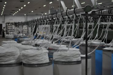 Spinning is the twisting together of drawn-out strands of fibers to form yarn, and is a major part of the textile industry.